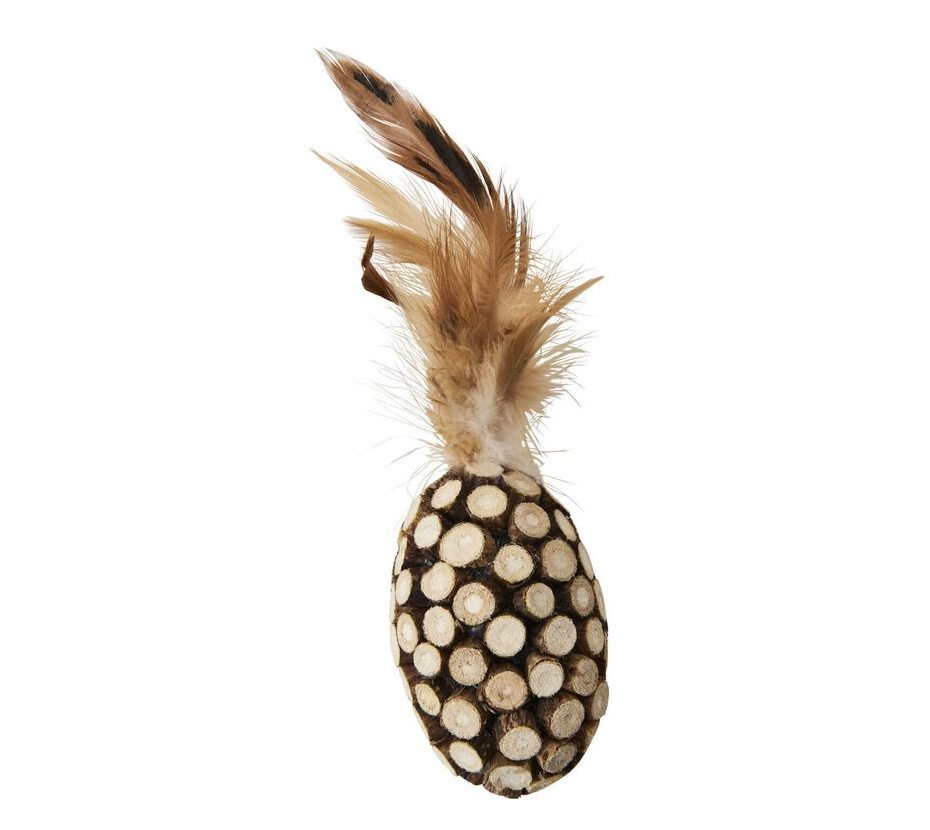 Artistic pineapple decor with feather top and shell body on a neutral background.