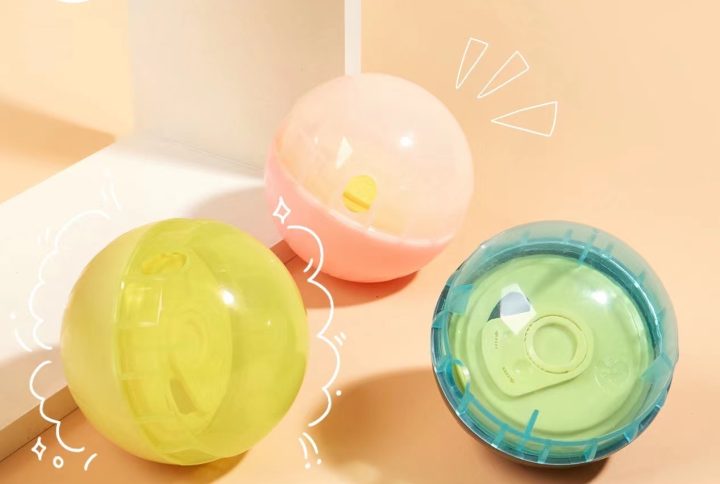 Colorful interactive pet toy balls for mental stimulation, in blue, yellow, and pink.