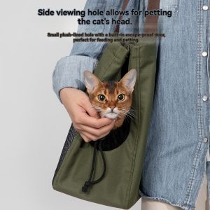 Stylish green pet carrier with cat viewing hole for comfortable transportation.